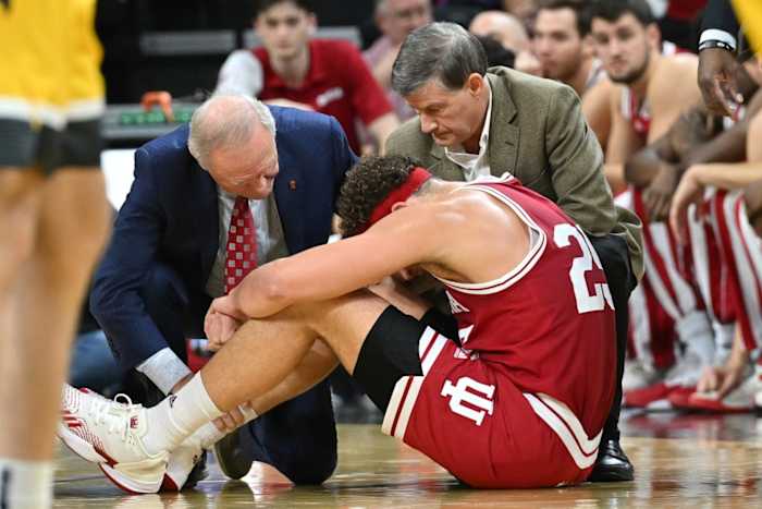 Indiana Hoosiers medical staff work on forward Race Thompson (25) during the first half against the Iowa Hawkeyes at Carver-Hawkeye Arena.